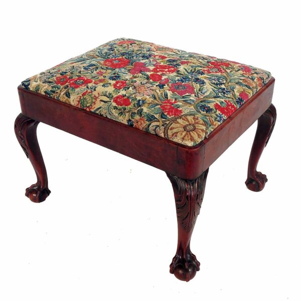 A Georgian design rectangular footstool with upholstered top