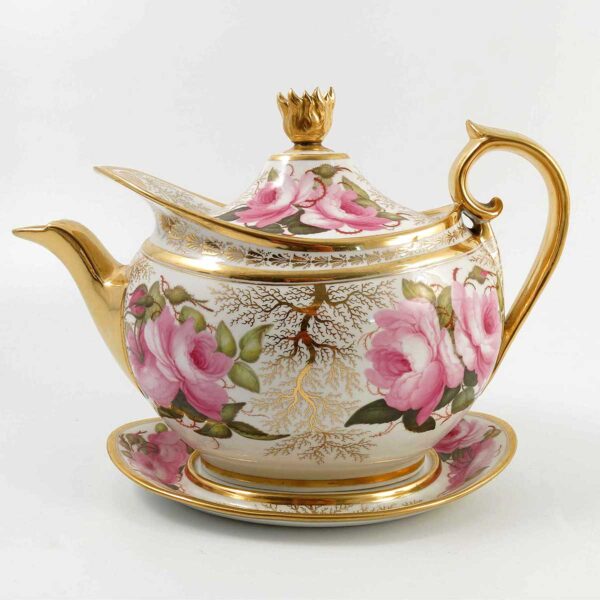 A Flight Barr & Barr Worcester porcelain teapot and stand, decorated with pink roses and a gilt seaweed to a white ground