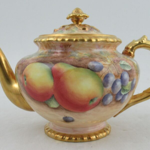 A Royal Worcester tea pot decorated by Leaman