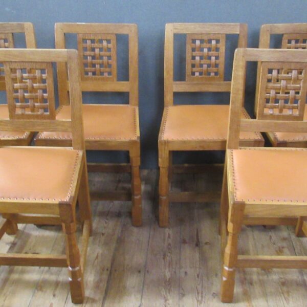 A Robert Thompson Mouseman 1970's set of six oak dining chairs