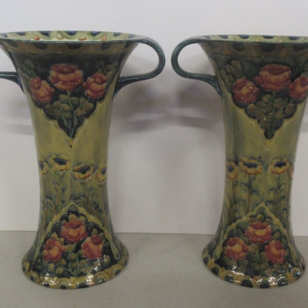 A pair of Moorcroft McIntyre two handled vases, decorated with Ochre Poppy pattern